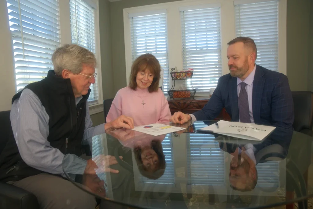 Jeff Beyer of Paladin Retirement Advisors reviewing a retirement plan with a couple during a Discovery Session in Newtown PA