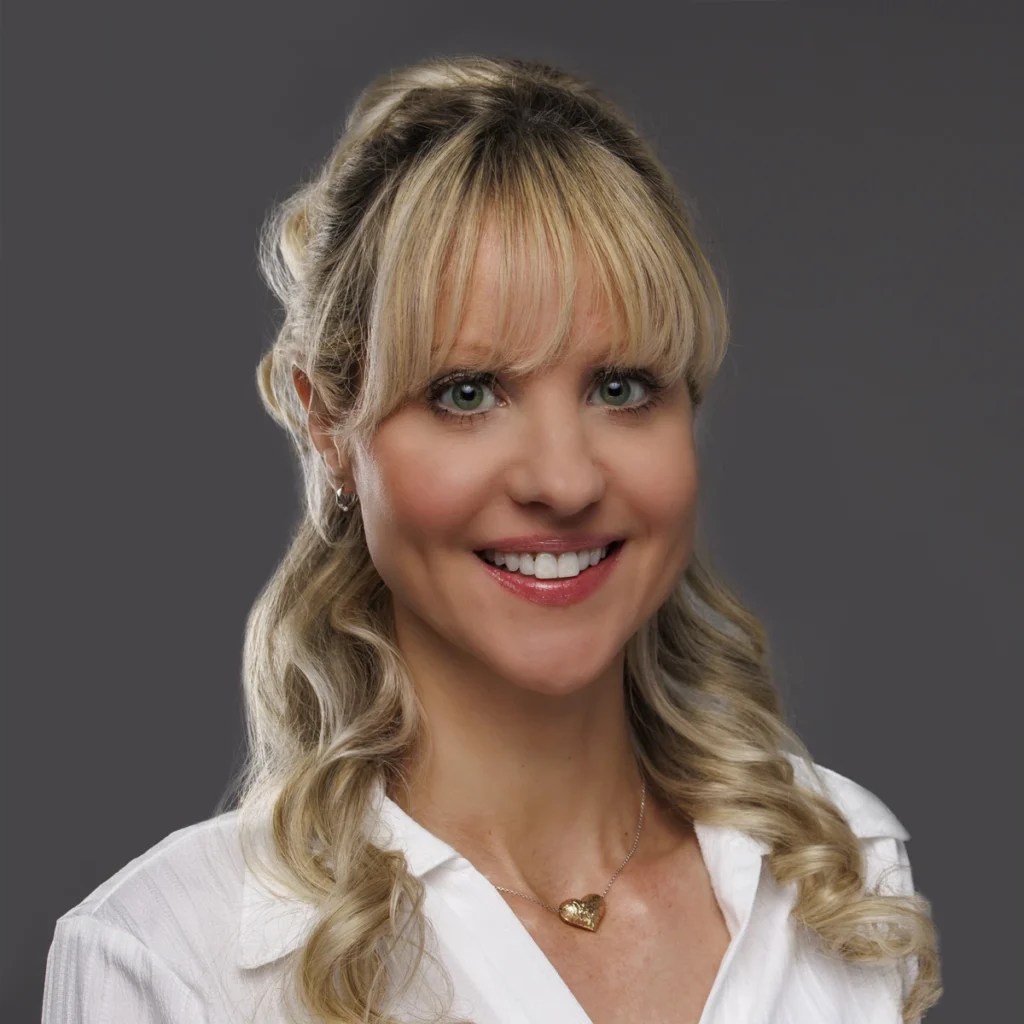 Beth Beyer, COO of Paladin Retirement Advisors, professional headshot on gray background