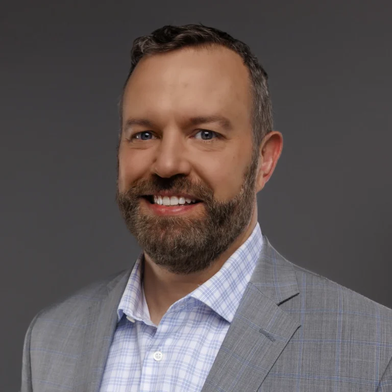 Jeff Beyer, Founder and CEO of Paladin Retirement Advisors, professional headshot on gray background